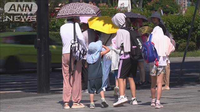 顔すっぽり中国の日焼け防止マスク　上海今月40度超の猛暑　日焼け防止市場急成長